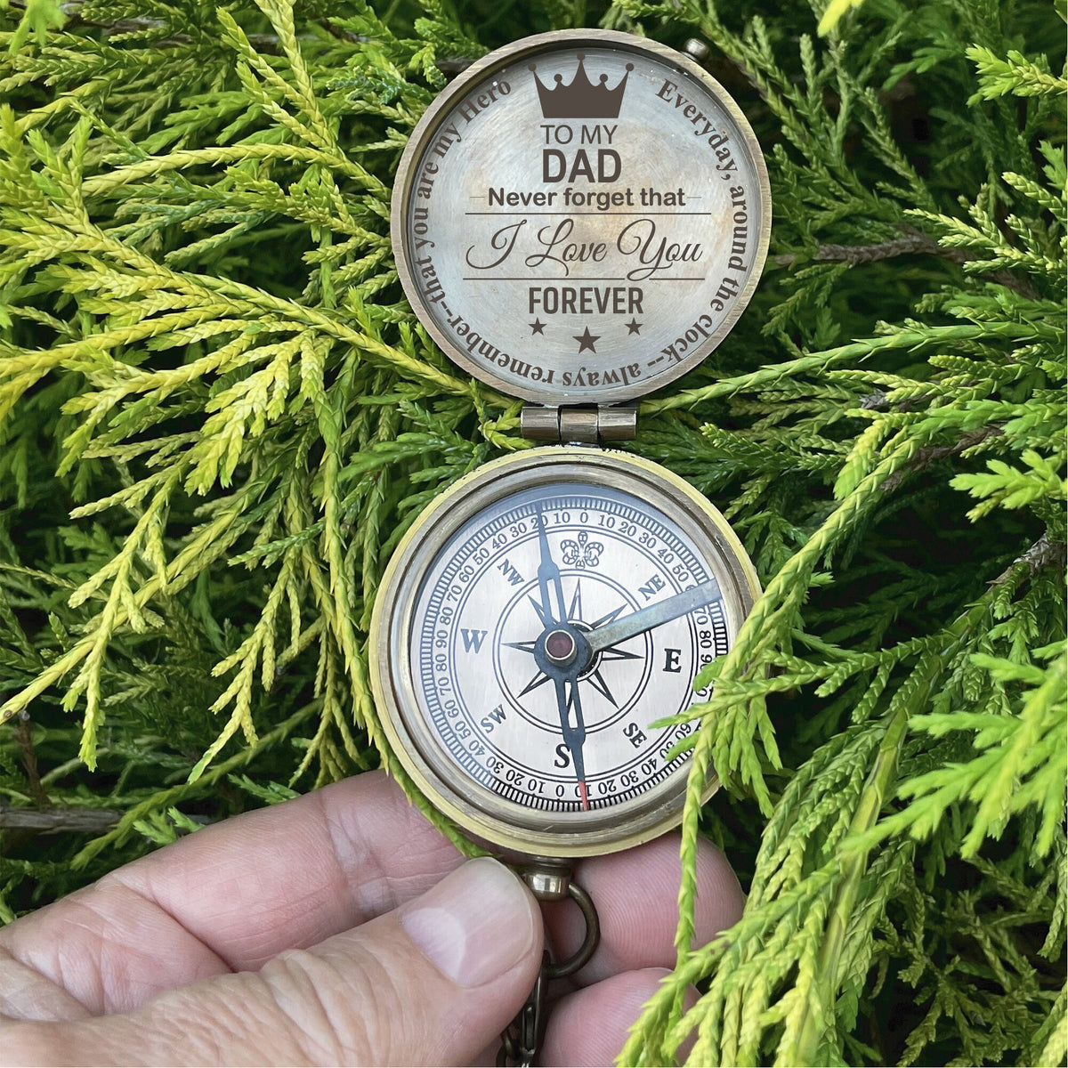 May include: A brass compass with a compass rose and a message on the lid that reads "To my Dad Never forget that I love you Forever".