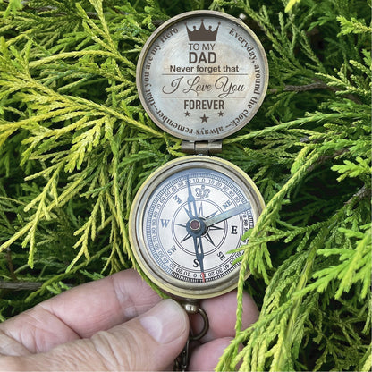 May include: A brass compass with a compass rose and a message on the lid that reads "To my Dad Never forget that I love you Forever".