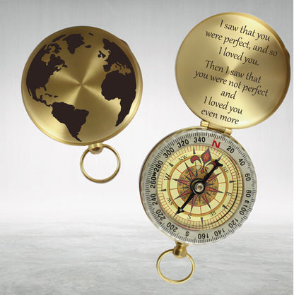 May include: A gold compass with a world map on the lid. The compass is open and the lid has an inscription that reads: "I saw that you were perfect, and so I loved you. Then I saw that you were not perfect and I loved you even more."