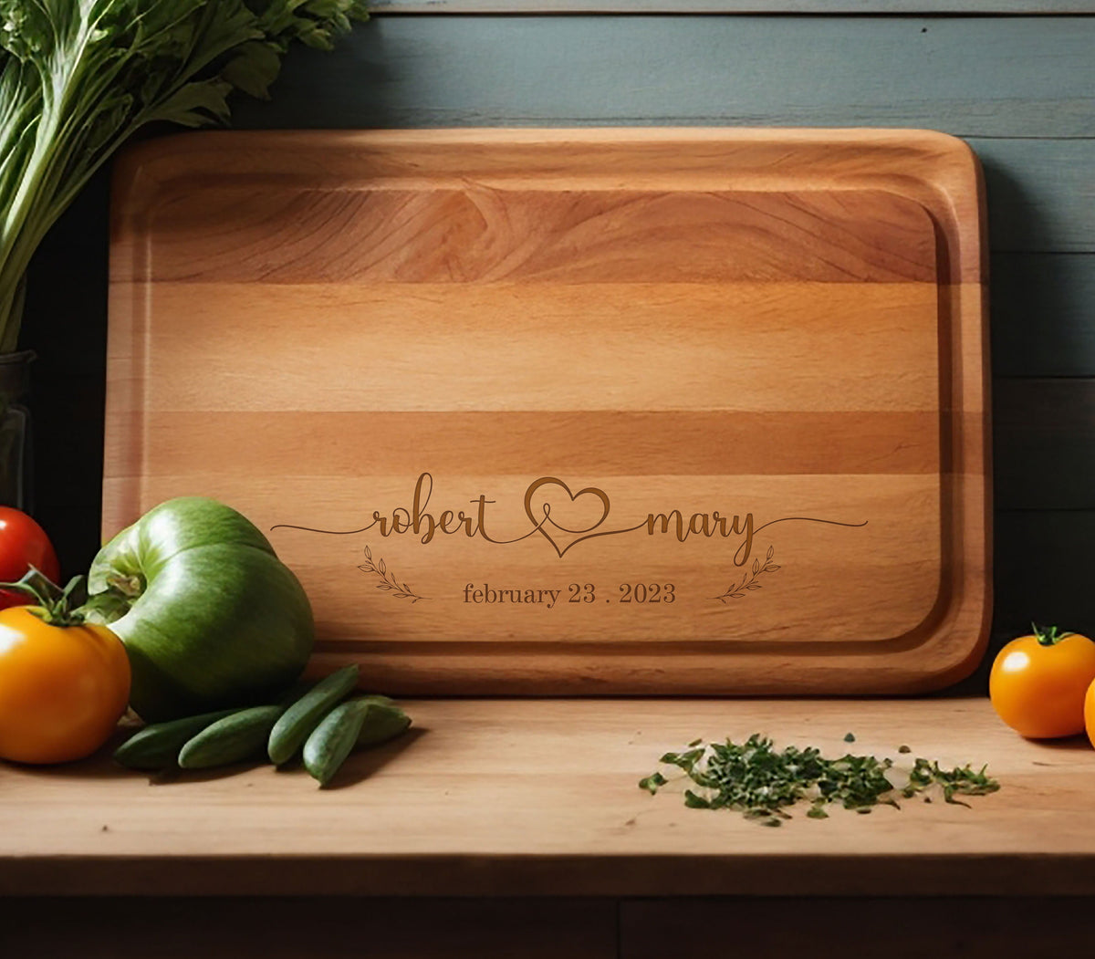 May include: Personalized wooden cutting board with the names "robert & mary" and the date "february 23, 2023" engraved on it.