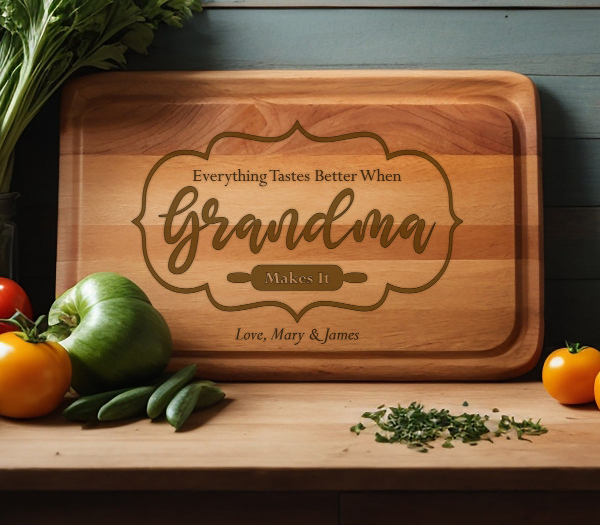 May include: A wooden cutting board with the text "Everything Tastes Better When Grandma Makes It" and the names "Love, Mary & James" engraved on it.