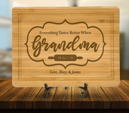 May include: A brown bamboo cutting board with the engraved text "Everything Tastes Better When Grandma Makes It" and "Love, Mary & James".