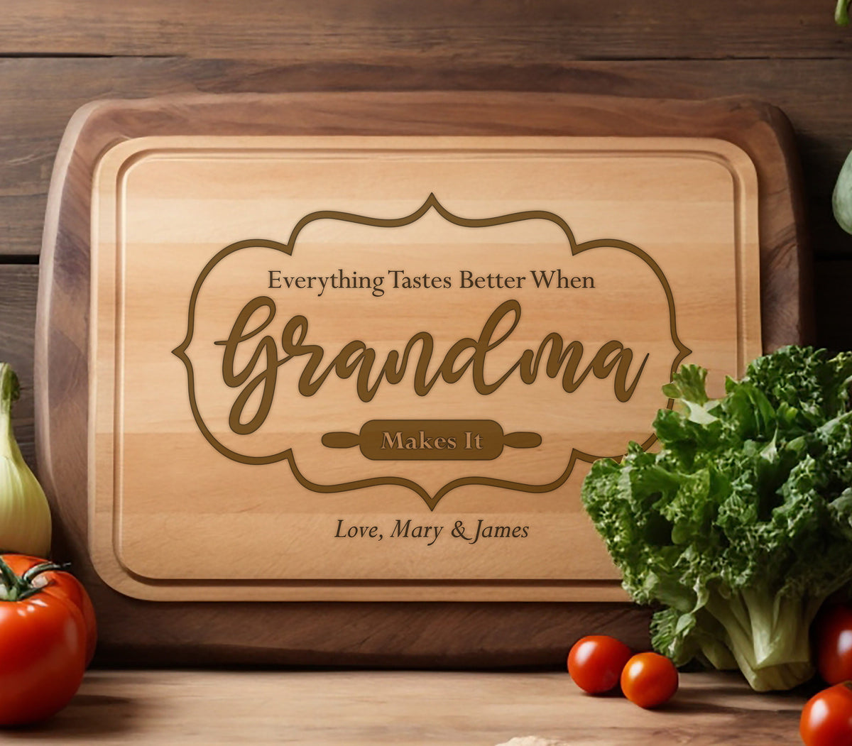 May include: A brown wooden cutting board with the text "Everything Tastes Better When Grandma Makes It" and the names "Love, Mary & James" engraved on it. 