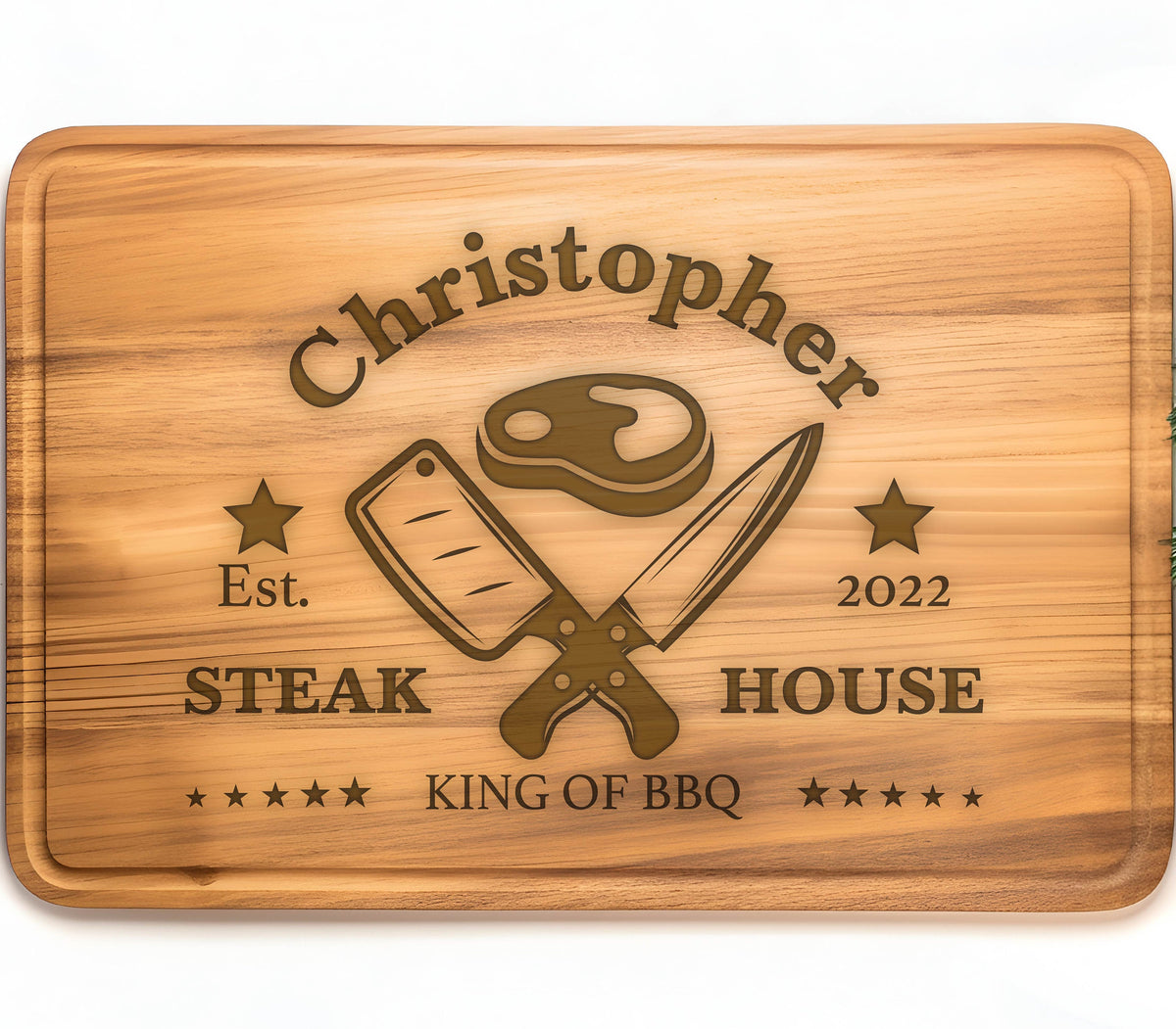May include: Personalized wooden cutting board with the text "Christopher Steak House Est. 2022 King of BBQ" and a graphic of crossed butcher knives and a steak.