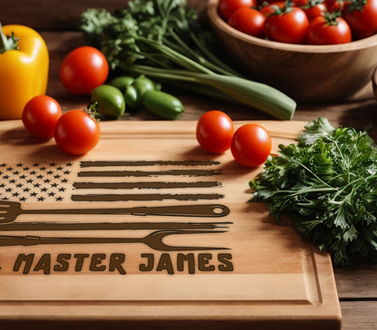 May include: A wooden cutting board with an American flag design, a grill tool graphic, and the text "Master James". The board is surrounded by fresh vegetables and tomatoes.