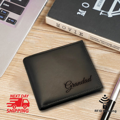 May include: Black leather wallet with the word "Grandad" engraved in a cursive font. The wallet has RFID blocking technology.