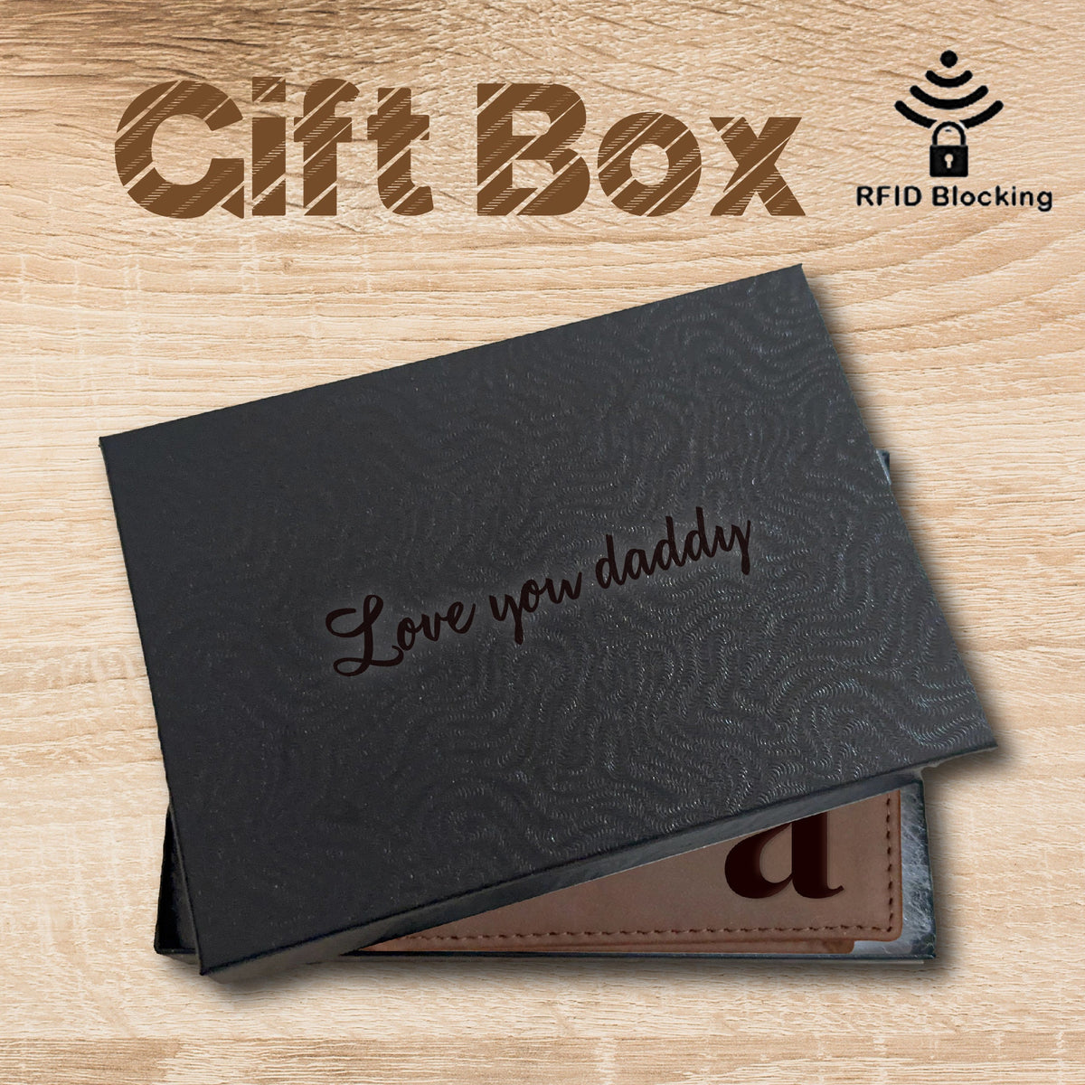 May include: A brown leather wallet with the letter "a" embossed on the front. The wallet is in a black gift box with the words "Love you daddy" engraved on the inside of the lid. The box also has a small RFID blocking symbol on the top.