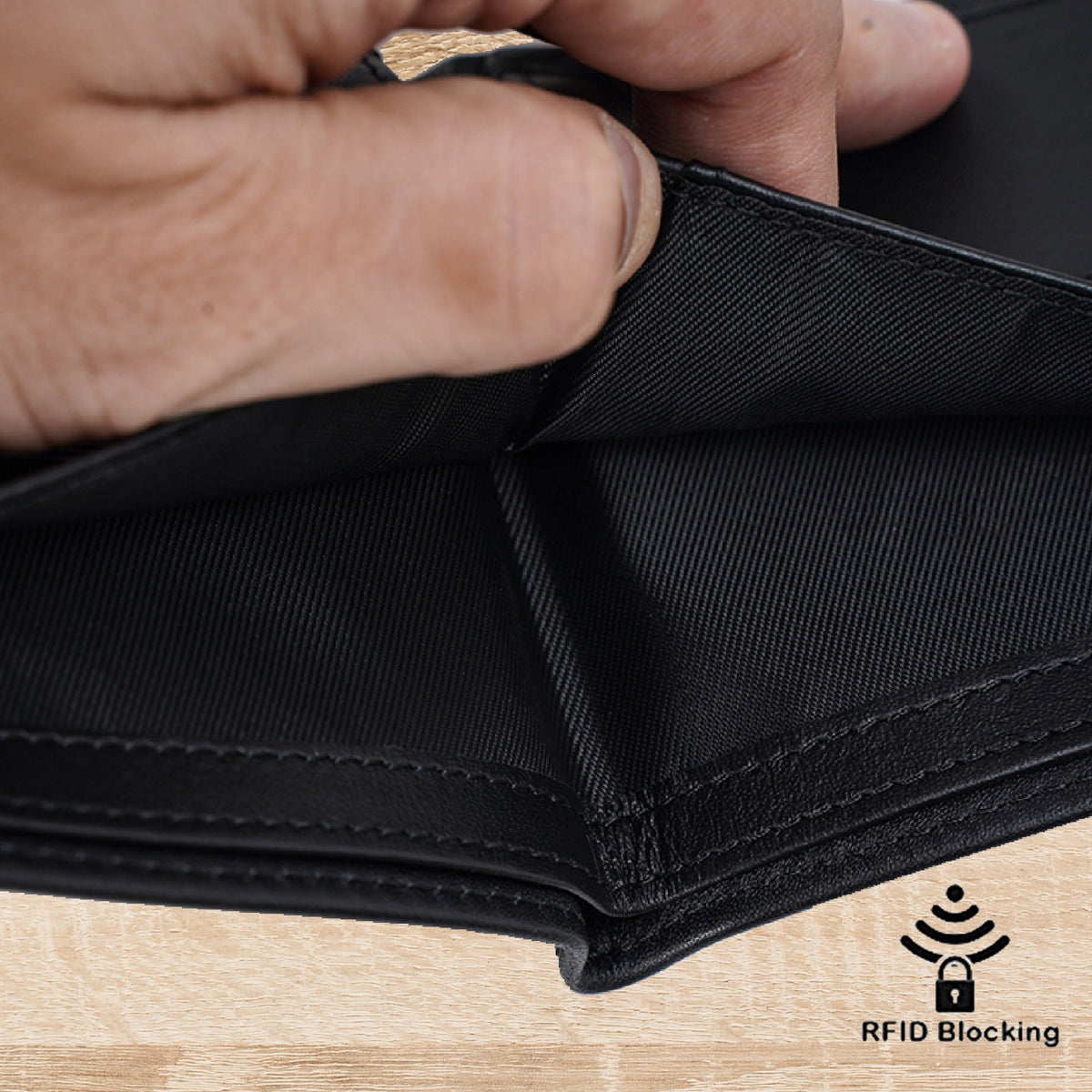 May include: Black leather wallet with RFID blocking technology. The wallet is open to show the interior lining.
