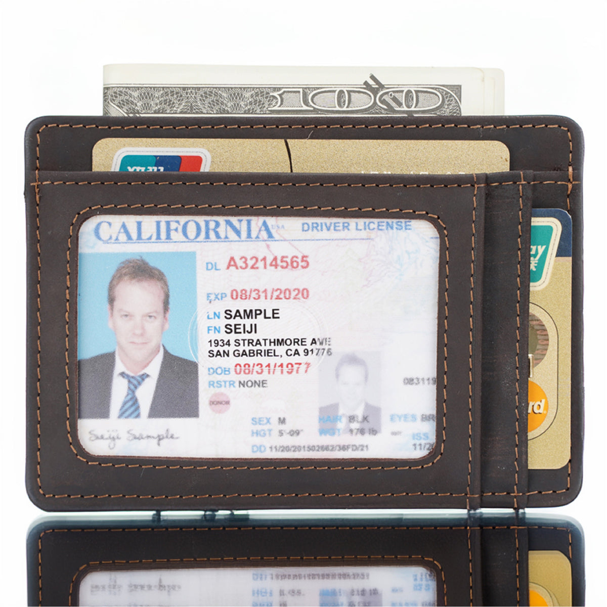 May include: A brown leather wallet with a clear window for displaying a driver's license. The license shows the name "SAMPLE SEIJI" with a California driver's license number A3214565. The wallet has a stitched border and a slot for holding additional cards.