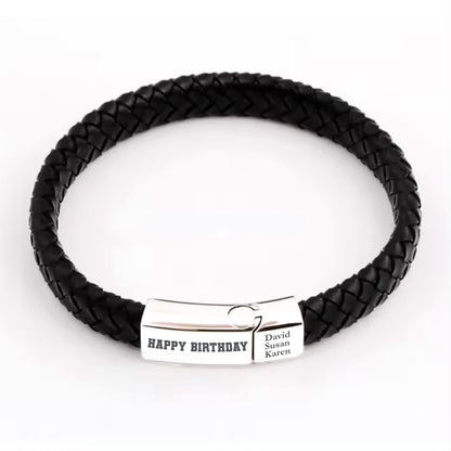 May include: Black leather braided bracelet with a silver clasp engraved with "Happy Birthday" and the names "David, Susan, Karen".