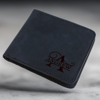 May include: A black leather wallet with a personalized monogram. The monogram is a stylized "A" with the name "ANDREW" written below it.