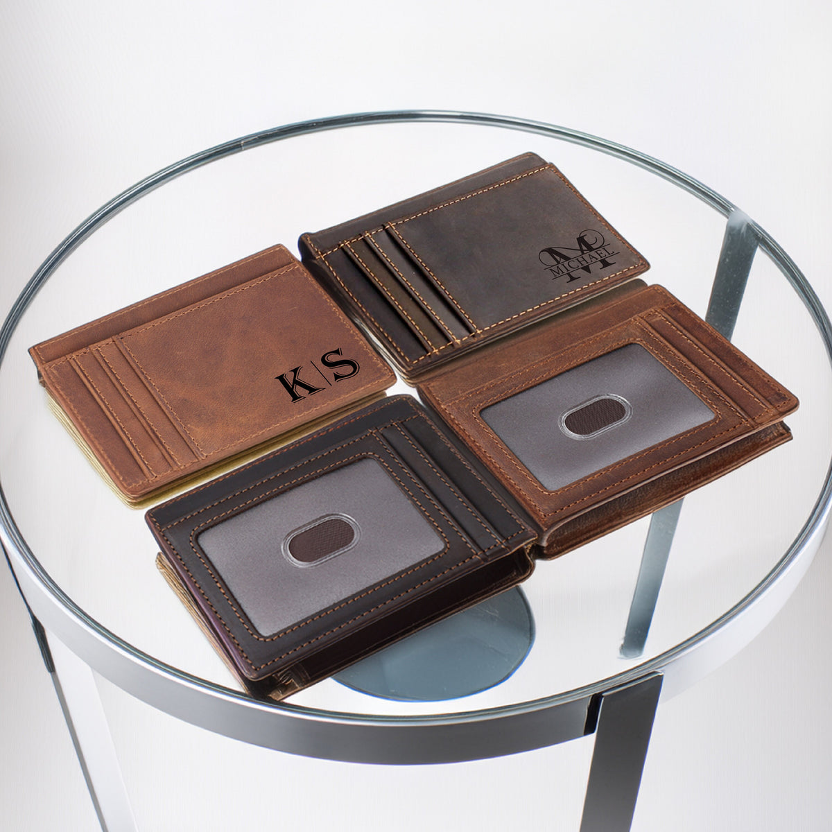May include: Four brown leather wallets with different initials engraved on the front. The wallets have multiple card slots and a clear ID window.