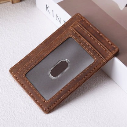 May include: A brown leather wallet with a clear ID window and multiple card slots.