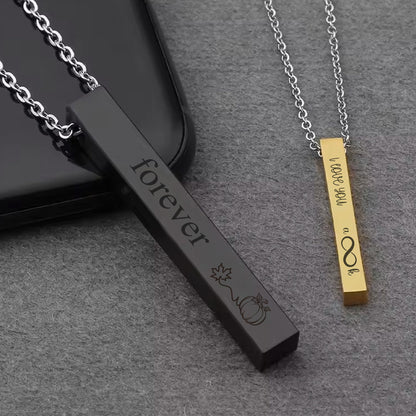 May include: Two bar necklaces with engraved messages. One black bar necklace says "forever" with a pumpkin and leaf design. The other gold bar necklace says "I love you a lot" with an infinity symbol.