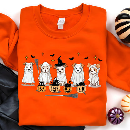 May include: Orange Halloween-themed sweatshirt featuring a graphic of six dogs dressed in costumes. The dogs are wearing ghost costumes, witch hats, and sitting next to carved pumpkins. A broom and bats are also included in the design.
