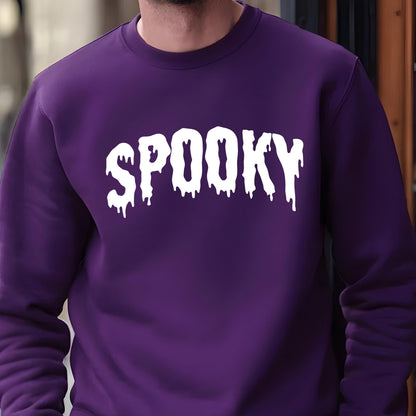 May include: A deep purple long-sleeve crewneck sweatshirt featuring the word SPOOKY printed in a white, dripping, liquid-style font across the chest. The garment has a ribbed neckline and cuffs, providing a clean and structured appearance.