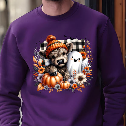 May include: A deep purple crewneck sweatshirt featuring a graphic print of a fluffy brown highland cow wearing an orange knit beanie, standing next to a white ghost, orange pumpkins, and autumn flowers against a black and white buffalo plaid square.