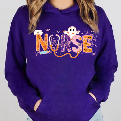 May include: A purple hooded sweatshirt with the word "NURSE" in a Halloween-themed design. The letters are decorated with pumpkins, bats, spiderwebs, and a ghost. A stethoscope and syringe are also included in the design.