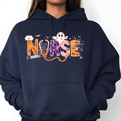May include: Navy blue hoodie with a colorful Halloween-themed "NURSE" graphic. The design includes a ghost, bats, spiderwebs, and a stethoscope. The letters are decorated with pumpkins and other spooky elements.