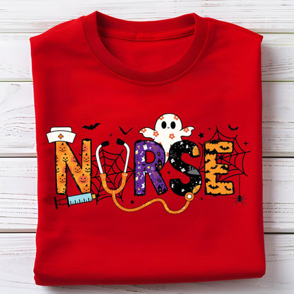 May include: A red crew neck sweatshirt with a Halloween-themed design. The word "NURSE" is spelled out with a stethoscope, a ghost, and other Halloween elements. The letters are decorated with pumpkins, spiderwebs, and bats.