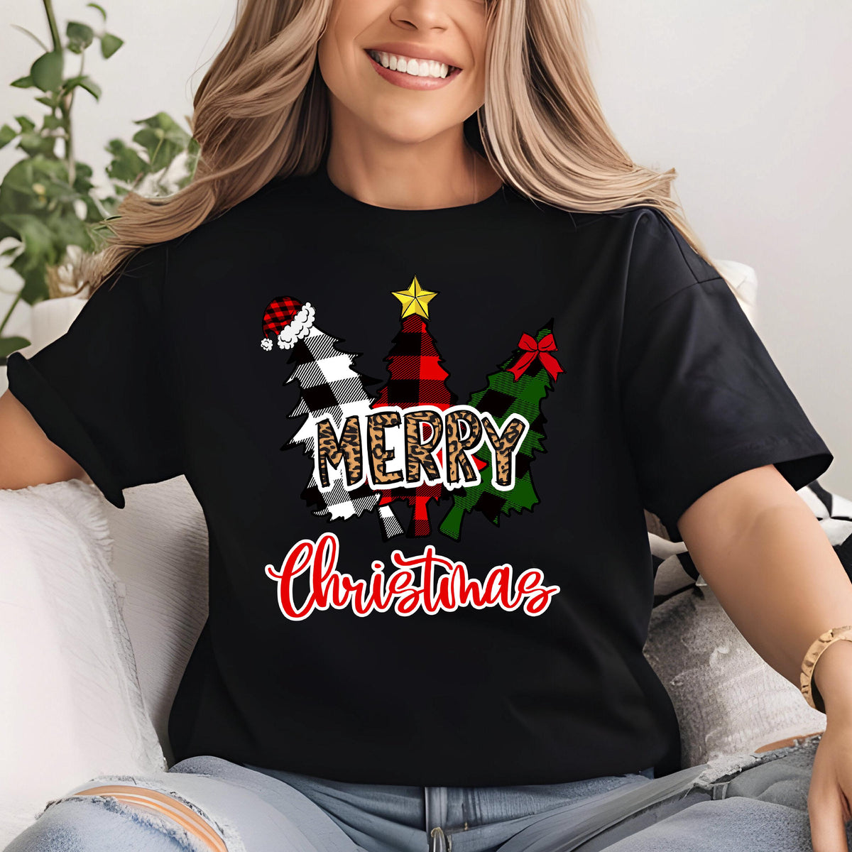 May include: A black short-sleeve t-shirt featuring a graphic of three stylized Christmas trees in black and white buffalo plaid, red and black plaid, and green patterns. The text MERRY is in leopard print and Christmas is in red script.