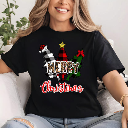 May include: A black short-sleeve t-shirt featuring a graphic of three stylized Christmas trees in black and white buffalo plaid, red and black plaid, and green patterns. The text MERRY is in leopard print and Christmas is in red script.