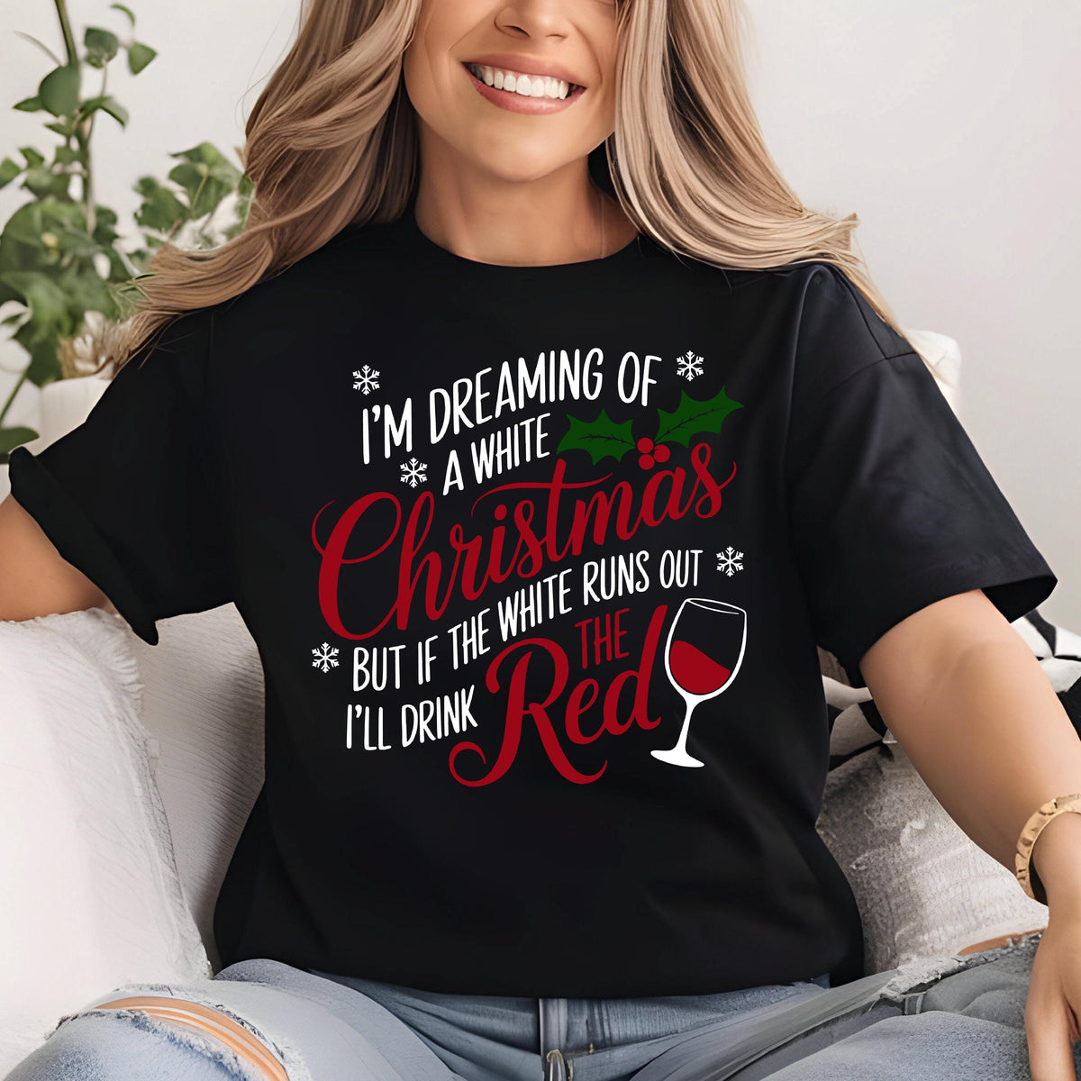 May include: Black t-shirt with the text "I'M DREAMING OF A WHITE Christmas BUT IF THE WHITE RUNS OUT I'LL DRINK THE Red" in white and red. The design includes snowflakes, holly, and a wine glass.