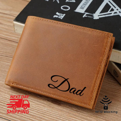 May include: A brown leather wallet with the word "Dad" embossed in black lettering. The wallet has RFID blocking technology.