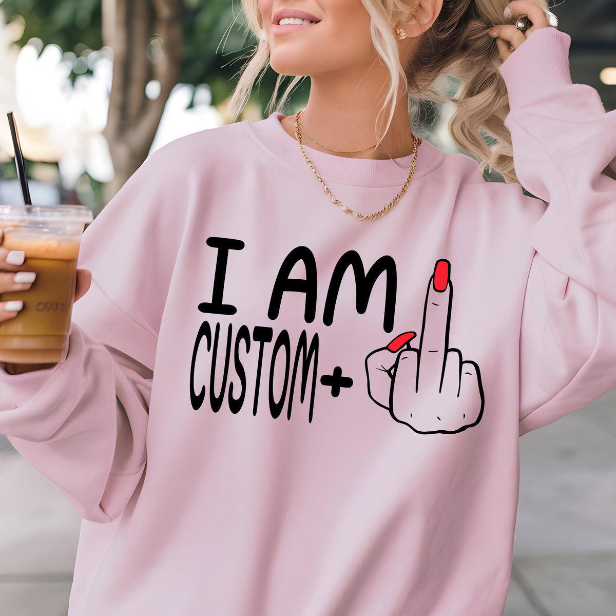 May include: Pink sweatshirt with the text "I AM CUSTOM+" and a cartoon hand giving the middle finger.