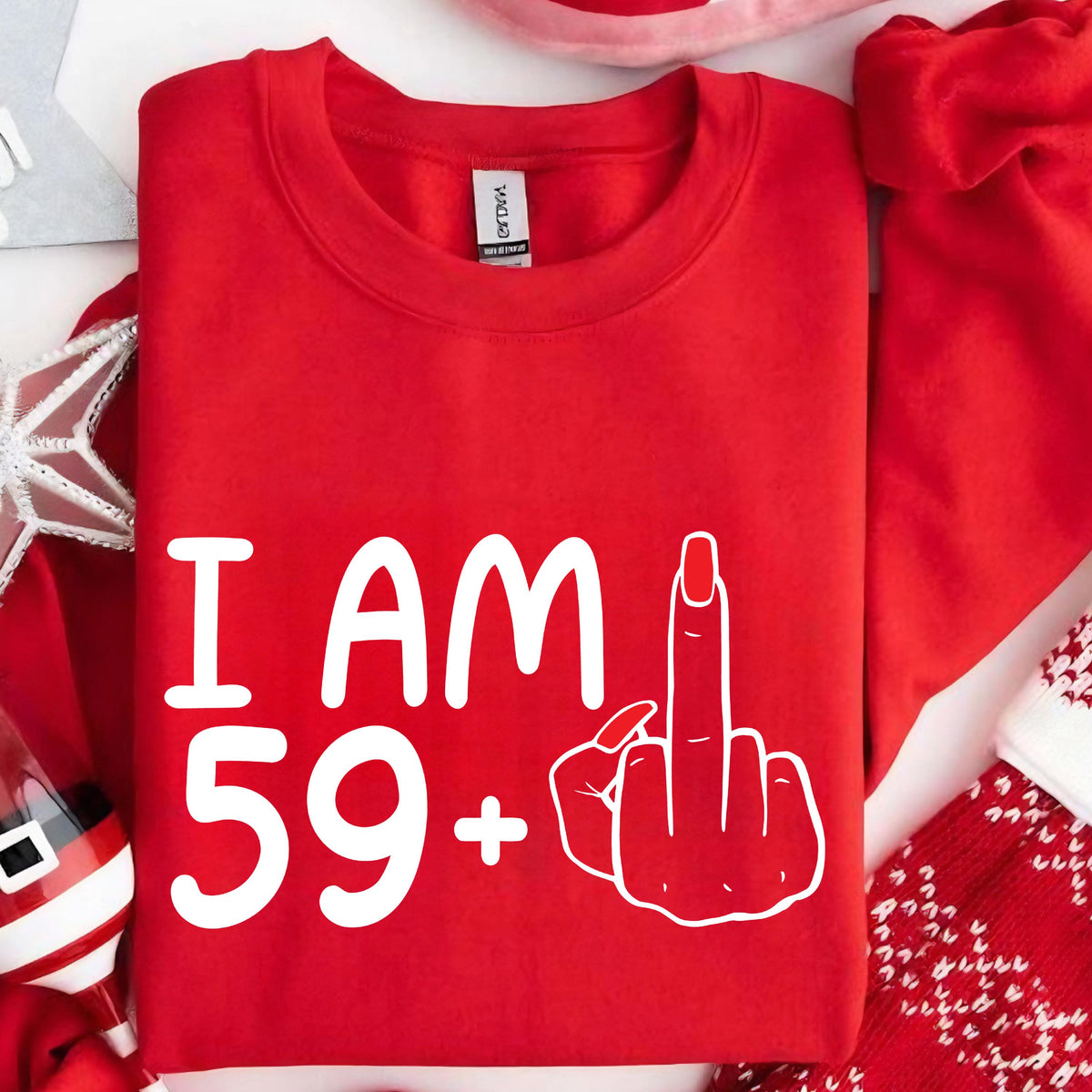 May include: Red sweatshirt with white text that says "I AM 59+" and a white middle finger graphic.