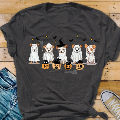 May include: A dark gray t-shirt featuring a graphic of five dogs dressed in white ghost costumes. Some dogs are sitting inside orange jack-o'-lantern pumpkins with black cats. The design includes small black bats and yellow stars in the background.