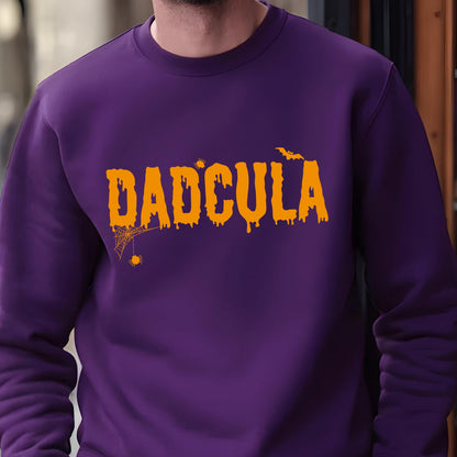 May include: Purple sweatshirt with the text "DADCULA" in orange dripping letters. The text is surrounded by a spider web and a bat.