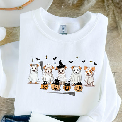 May include: White sweatshirt featuring a Halloween-themed design. The graphic includes cartoon dogs in costumes, such as ghosts and a witch, with pumpkins and bats. A broom is also included in the design.
