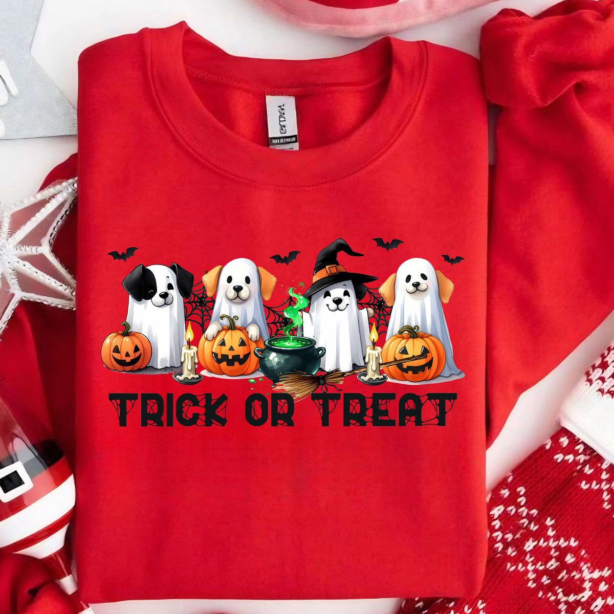 May include: Red sweatshirt with a Halloween-themed graphic. The design features four dogs dressed as ghosts, pumpkins, candles, bats, and the text "TRICK OR TREAT" in black.