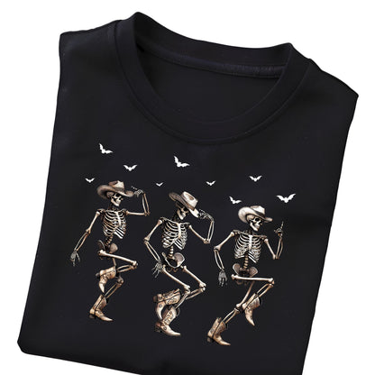 May include: Black t-shirt featuring a graphic of three dancing skeletons wearing cowboy hats and boots. White bats are scattered across the top of the design. The skeletons are in various dance poses.