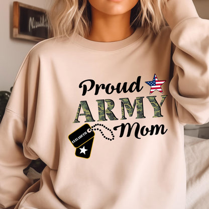 May include: A beige sweatshirt with the text "Proud ARMY Mom" in black and camouflage green. A star with a US flag design is above the word "Mom". A dog tag with the name "Elizabeth" is attached.