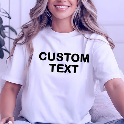 May include: A white short-sleeved t-shirt featuring the words CUSTOM TEXT printed in bold black capital letters across the center of the chest. The garment has a classic crew neckline and a standard fit, providing a clean and simple appearance.