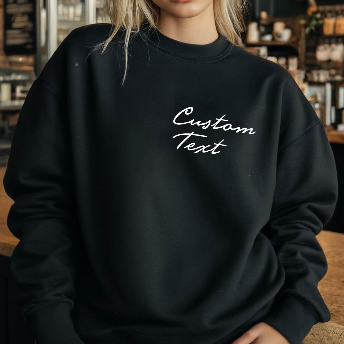 May include: Black sweatshirt with the text "Custom Text" in white script on the front.