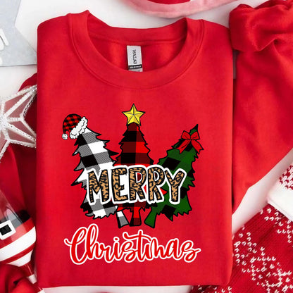 May include: A bright red crewneck sweatshirt featuring a graphic of three stylized Christmas trees. The trees display black and white buffalo plaid, red and black plaid, and green patterns. The word MERRY is in leopard print, with Christmas below.