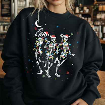 May include: A black crewneck sweatshirt featuring a graphic of three white skeletons wearing red Santa hats. The skeletons are wrapped in colorful Christmas light strands and are surrounded by small white, blue, and red stars and snowflakes.