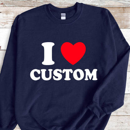May include: Navy blue sweatshirt with the text "I ♥ CUSTOM" in white and a red heart. The sweatshirt is a crew neck style.