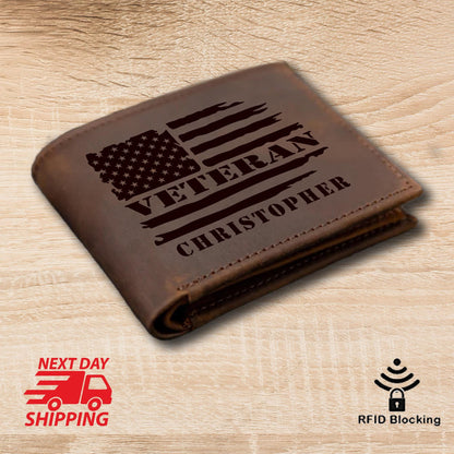 May include: Brown leather wallet with an American flag and the word "Veteran" engraved on it. The name "Christopher" is also engraved on the wallet.