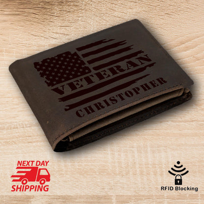 May include: Brown leather wallet with an American flag design and the words "Veteran" and "Christopher" engraved on it.
