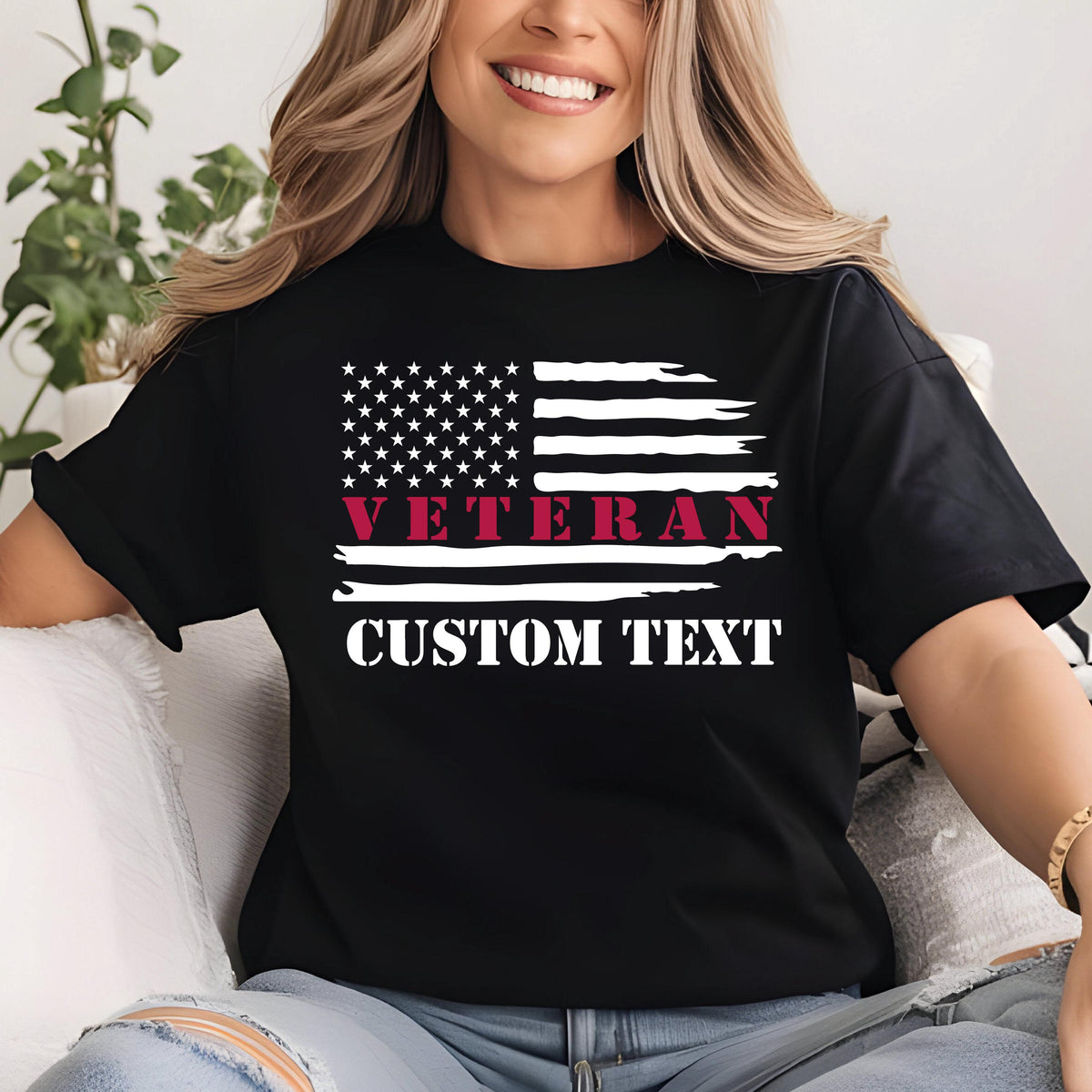 May include: Black t-shirt featuring a distressed American flag design. The flag includes white stars and stripes, with the word "VETERAN" in burgundy and the words "CUSTOM TEXT" in white. The shirt is a classic crew neck.