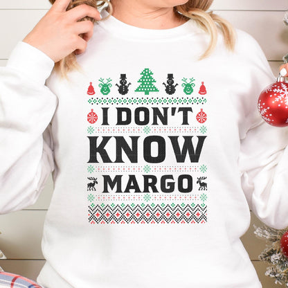 May include: White Christmas sweater with a red, green, and black patterned design. The sweater has the text "I don't know Margo" in black.