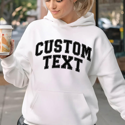 May include: White hooded sweatshirt with black text that says "CUSTOM TEXT" in a collegiate font.
