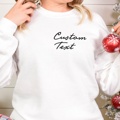 May include: White sweatshirt with the text "Custom Text" in black script on the front.