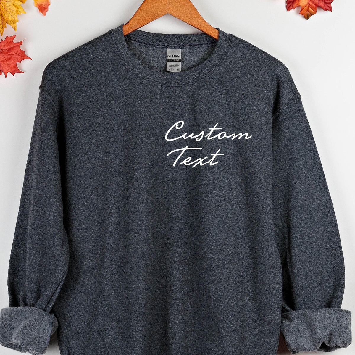 May include: A dark gray sweatshirt with the text "Custom Text" printed in white on the front.