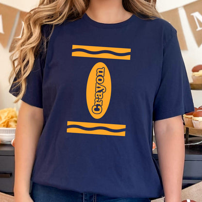 May include: A navy blue t-shirt with a yellow crayon design. The crayon is outlined in black and the word "Crayon" is written vertically inside the crayon.