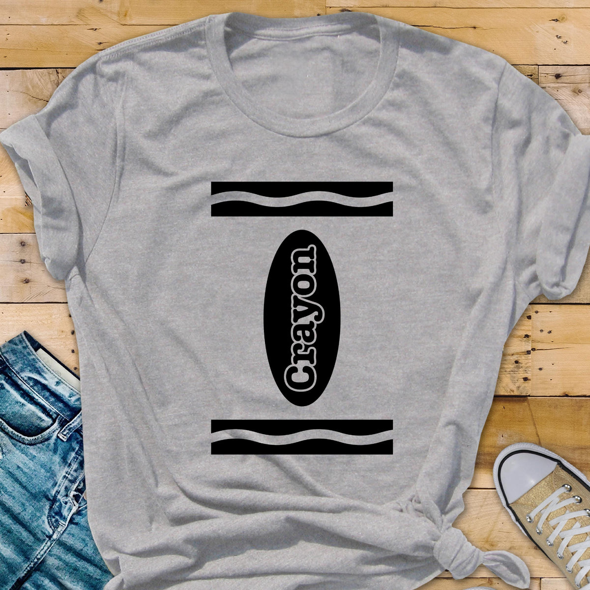 May include: Gray t-shirt with a black and white crayon design. The crayon is labeled "Crayon".